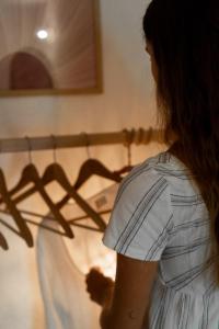 a woman standing in front of a bed at Casa Prana in Tegna +67 photos