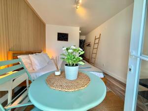 a small room with a table and a bed at IN-Cascais - Suite Deluxe with Terrace & Villa with Pool in Cascais