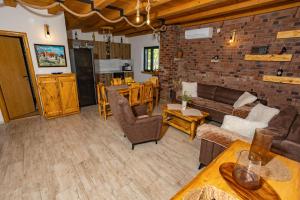 a living room with a couch and a table at Villa MaLea in Neum