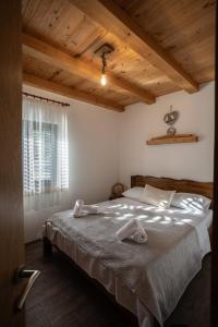a bedroom with a bed with two towels on it at Villa MaLea in Neum +28 photos