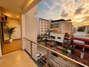 a balcony with a view of a city at Annapurna Prestine Puri - Comfortable Stay Near Jagannath Temple - with Free Wi-fi, Parking, Restaurant in Puri