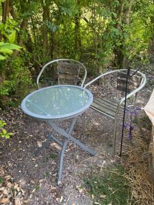 a table and two chairs sitting next to each other at Apple Tree glamping near Brighton in Saltdean