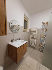 a bathroom with a sink and a mirror at Casa Conti Trivelli 2 in Vasto +29 photos