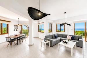 a living room with a couch and a table at Villa Argaka Heights in Argaka