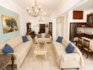 a living room with two couches and a table at Angels' House in Thessaloniki