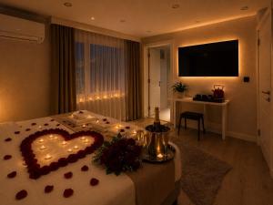 a room with a bed with a heart on it at Casa Florya Suites in Istanbul