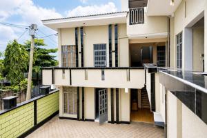 a view of a building with a balcony at NioneEdge-Arusha-Moshono in Themi