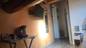 a room with a table with a coffee maker on it at Mas de chalvagne in Val-de-Chalvagne