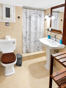 a bathroom with a toilet and a sink at Angels' House in Thessaloniki +18 photos