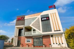 a building with a sign on top of it at Hotel O MK2 Hotel and Restaurant in Indore +21 photos
