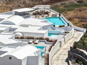 an aerial view of a resort with a swimming pool at Oikos Santorini Living Concept in Fira
