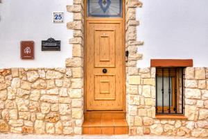 a wooden door on the side of a building at Carrebaix Loft in Orba