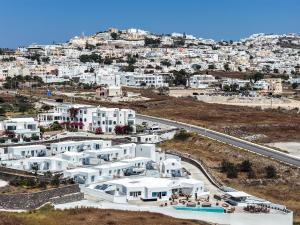 an aerial view of a city with white buildings at Oikos Santorini Living Concept in Fira +45 photos