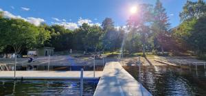 a view of a body of water with a pier at Frostavallen Hostel in Långstorp