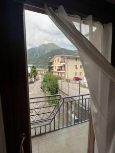 a balcony with a view of a mountain at Casa Balzarini- Vecchio Mulino in Entracque