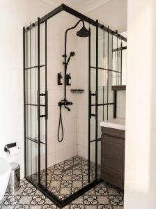 a shower with a glass door in a bathroom at BoStay Hotel in Istanbul +81 photos