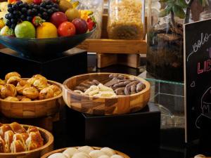 a display of different types of food in baskets at ibis Belo Horizonte Liberdade in Belo Horizonte