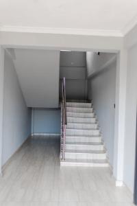 a staircase in a building with a stair case at Mlambe Executive Apartments in Lilongwe