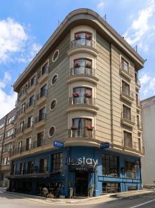 a large building with balconies on the side of it at BoStay Hotel in Istanbul