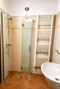 a bathroom with a glass shower and a sink at Tenuta VERBICARO in Morano Calabro