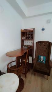 a dining room with a table and a chair at Dimond Villa in Greater Noida