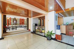 a lobby of a store with a dining room at Urbanview My Grand Hotel Bogor in Brujul