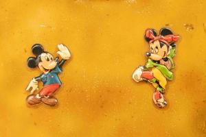 two mickey mouse pins on a yellow surface at Unique renovated chapel in Temse