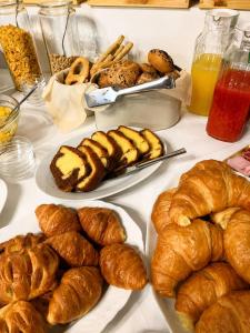 a table topped with plates of bread and pastries at Tenuta VERBICARO in Morano Calabro