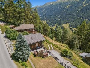 an aerial view of a house in the mountains at Chalet Siesta OG in Bellwald