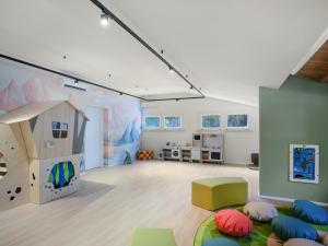 a large room with a play room with a play house at Mangia's Costa Ragusa Borgo - New Opening in Scoglitti