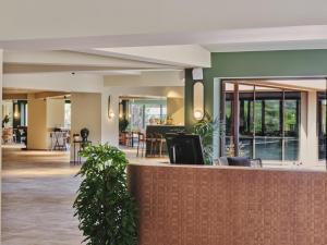 a lobby with a bar with plants in it at Mangia's Costa Ragusa Borgo - New Opening in Scoglitti +149 photos