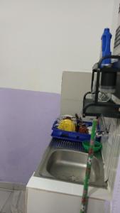 a kitchen sink with a toothbrush next to it at Js Immobilier in Abidjan
