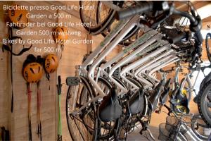 a bunch of bikes hanging on a wall at Residence Ledro in Ledro