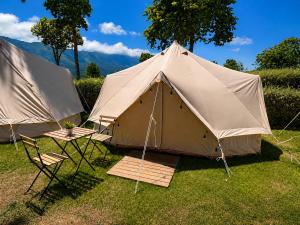 a large tent with chairs and a table and chairs at Kampaoh Bufones Pría in Garaña
