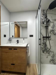 a bathroom with a sink and a shower at Casa Ara Montanejos in Montanejos +32 photos
