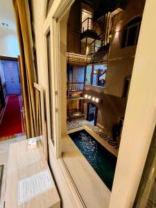 a room with a swimming pool inside of a building at Pyramids Nun INN in Cairo