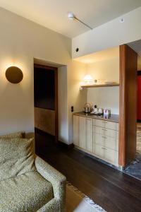 a living room with a couch and a counter at Hotel Frihavnen in Copenhagen