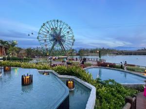 an amusement park with a ferris wheel in the background at 2 bedroom luxury apartment in Nuevo Nayarit