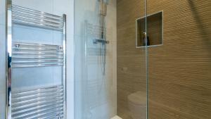 a shower with a glass door in a bathroom at Glangors in Abersoch +94 photos