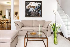 a living room with a couch and a table at Landhaus Gernitz in Seedorf