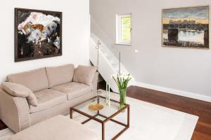 a living room with a couch and a table at Landhaus Gernitz in Seedorf