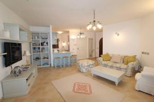 a living room with a couch and a table at Villa Lu Nibaru 2 in Cannigione
