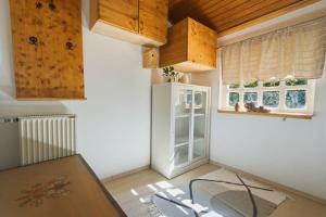 a kitchen with a white refrigerator in a room at Apartment Vineyard nook Lendava in Lendava