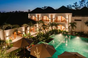 an aerial view of a house with a swimming pool at Casa Nova Villa Uluwatu in Uluwatu