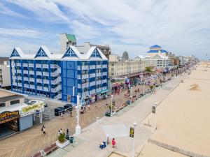 an aerial view of a beach with buildings and people at Ocean 1 Hotel & Suites Ocean City in Ocean City