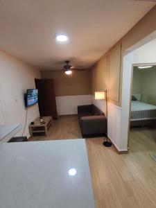a living room with a couch and a bed at Quiet place in El Seis