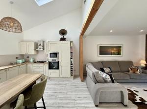 a living room with a couch and a table at Property 525 - Galway in Moycullen