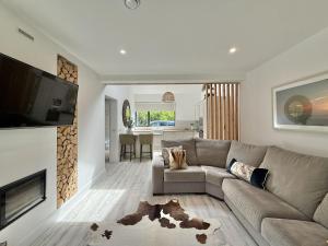 a living room with a couch and a tv at Property 525 - Galway in Moycullen