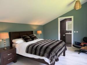 a bedroom with a large bed with green walls at Property 525 - Galway in Moycullen
