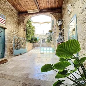 an entrance to a building with an archway at Chateau de Murviel in Murviel